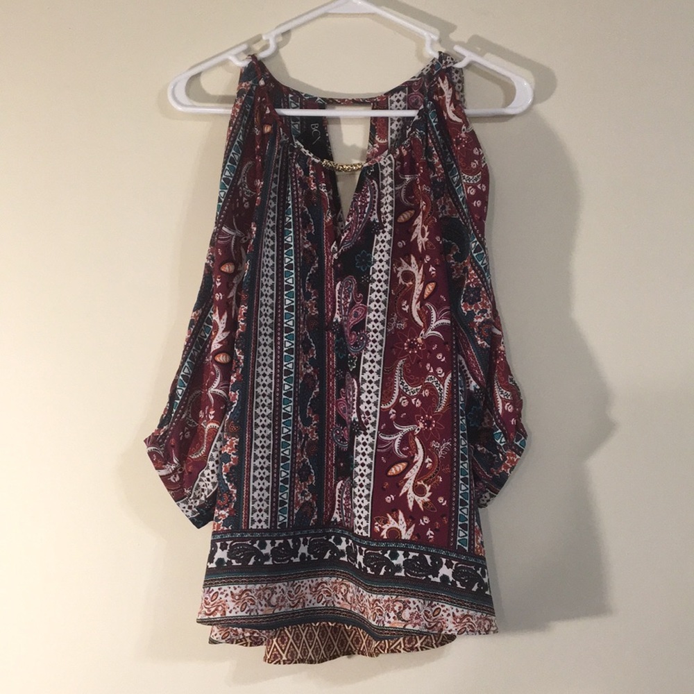 Maroon, black, teal, and white patterned blouse